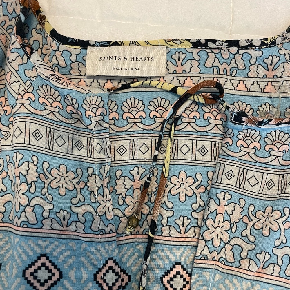 Women’s multi-pattern dress. Length hits right at or above the knee
